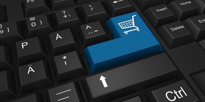 Convenios Marco Teclado de computadora con carrito de compras en tecla enter
