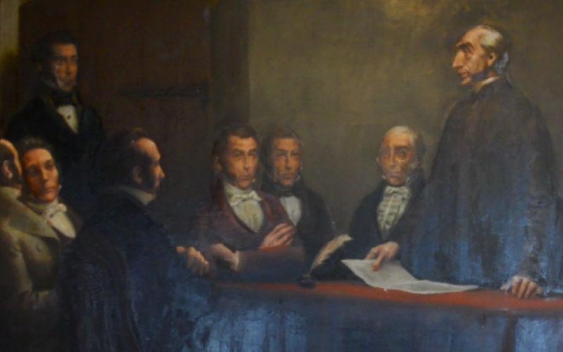 Cuadro de Eduardo de Amézaga Cuadro antiguo con personas sentadas en una mes