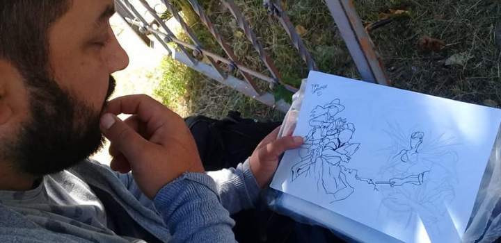 Proyecto Pintó Hombre mirando dibujo en papel