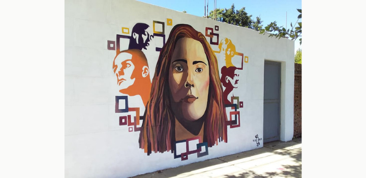 Ellas en Marzo, "Pintan las pibas" en Paysandú. Muro que ilustra el rostro de varias mujeres