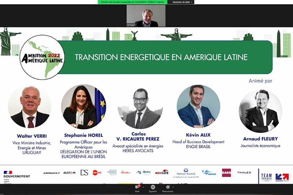 Panel en el que participó el ministro interino Verri Afiche de la mesa en que participó Verri; se ven las fotos de tres hombres y una mujer, además de él