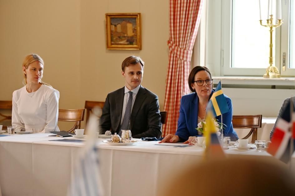 Swedish Foreign Minister and other authorities Swedish Foreign Minister seated alongside two other authorities