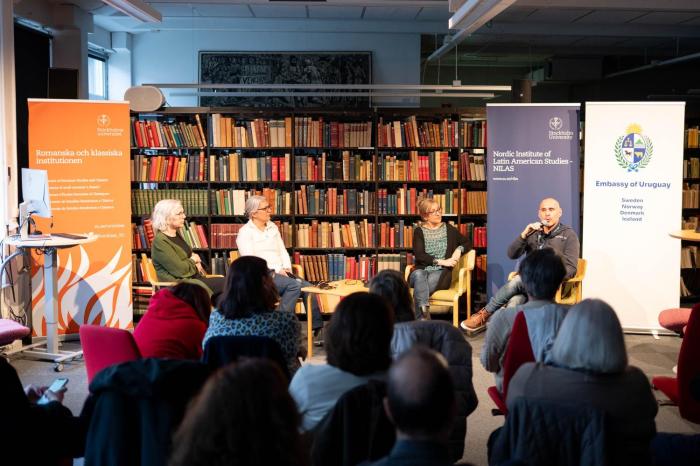 Panel/seminar members speaking and exchanging
