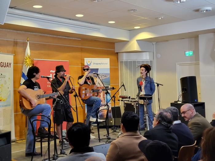 Musical band of four members and their instruments, on the stage of the Cervantes Institute