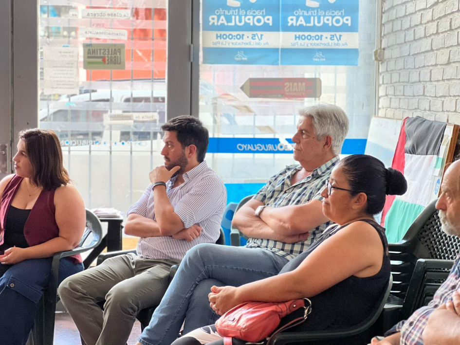 Bouret, Ruffinelli, Puig y una mujer durante la reunión