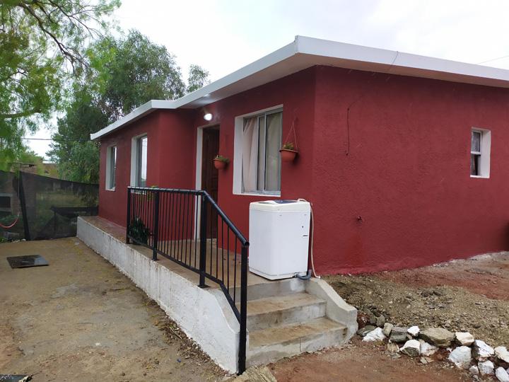 Plan Juntos Familia en la puerta de su vivienda Nueva